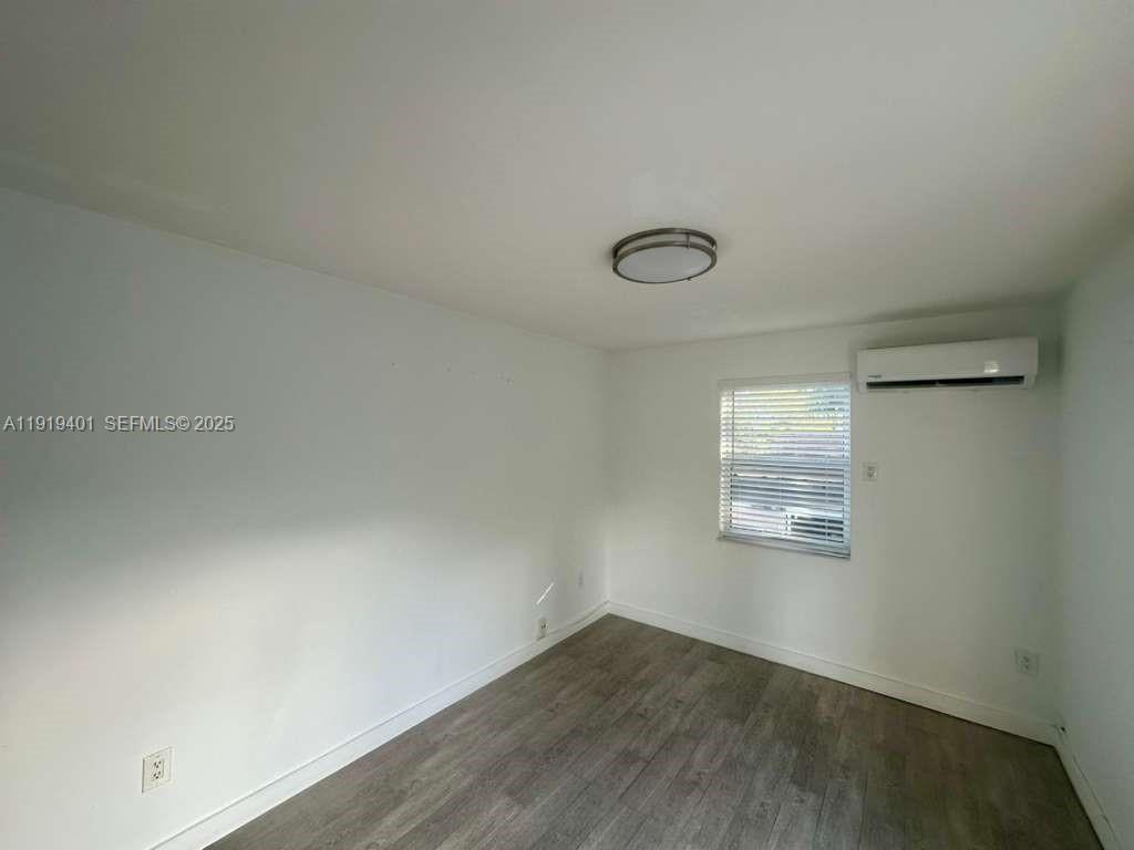 1150 Southwest 22nd Street, Unit 1 Miami, FL 33129 - Photo 7 of 13 an empty room with windows