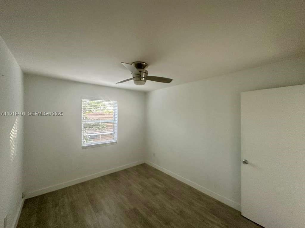 1150 Southwest 22nd Street, Unit 1 Miami, FL 33129 - Photo 10 of 13 an empty room with a window