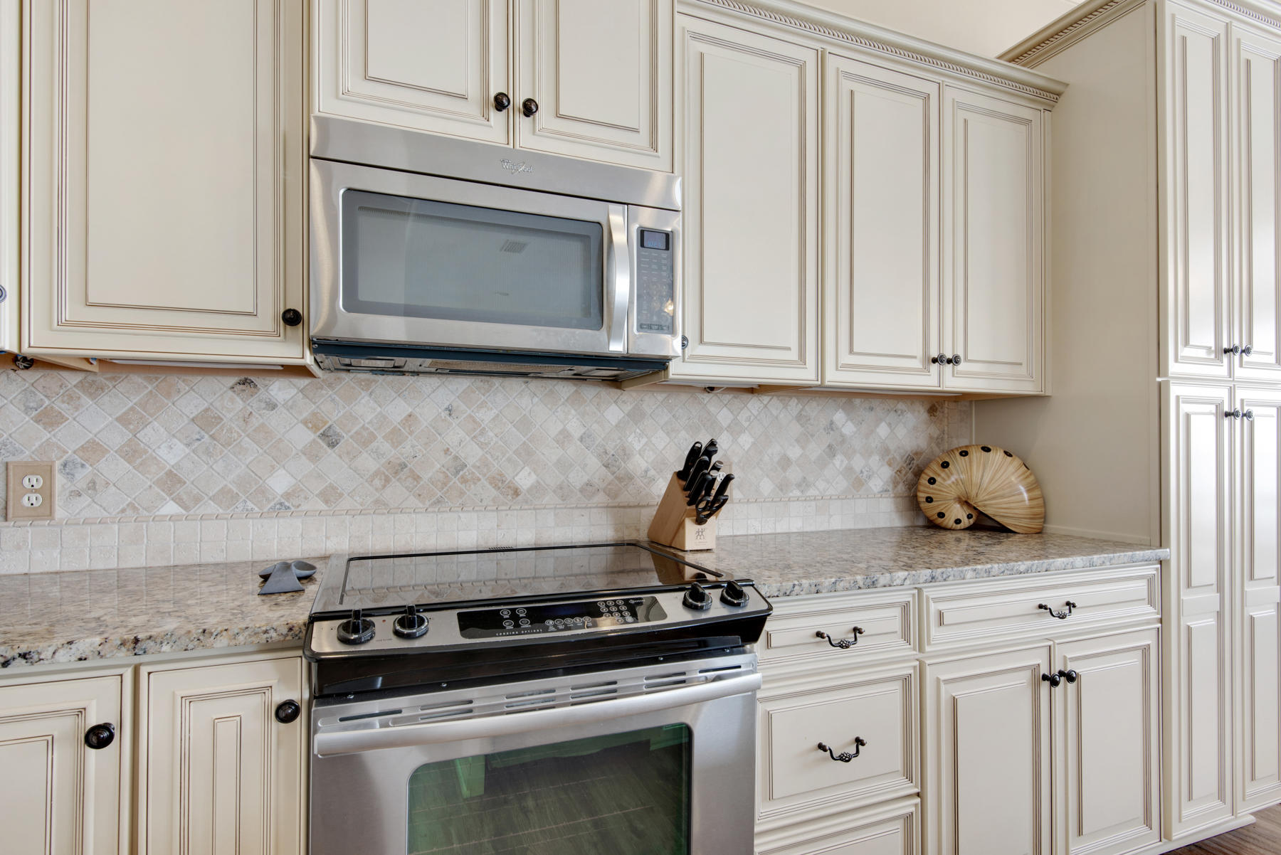 26 Nature Way, Unit 2004 Santa Rosa Beach, FL 32459 - Photo 13 of 65 a stove top oven sitting inside of a kitchen