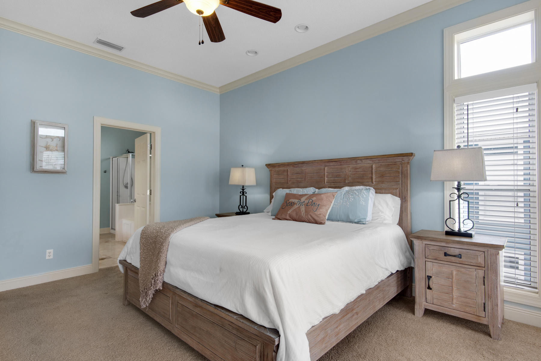 26 Nature Way, Unit 2004 Santa Rosa Beach, FL 32459 - Photo 16 of 65 a bedroom with a bed and a ceiling fan