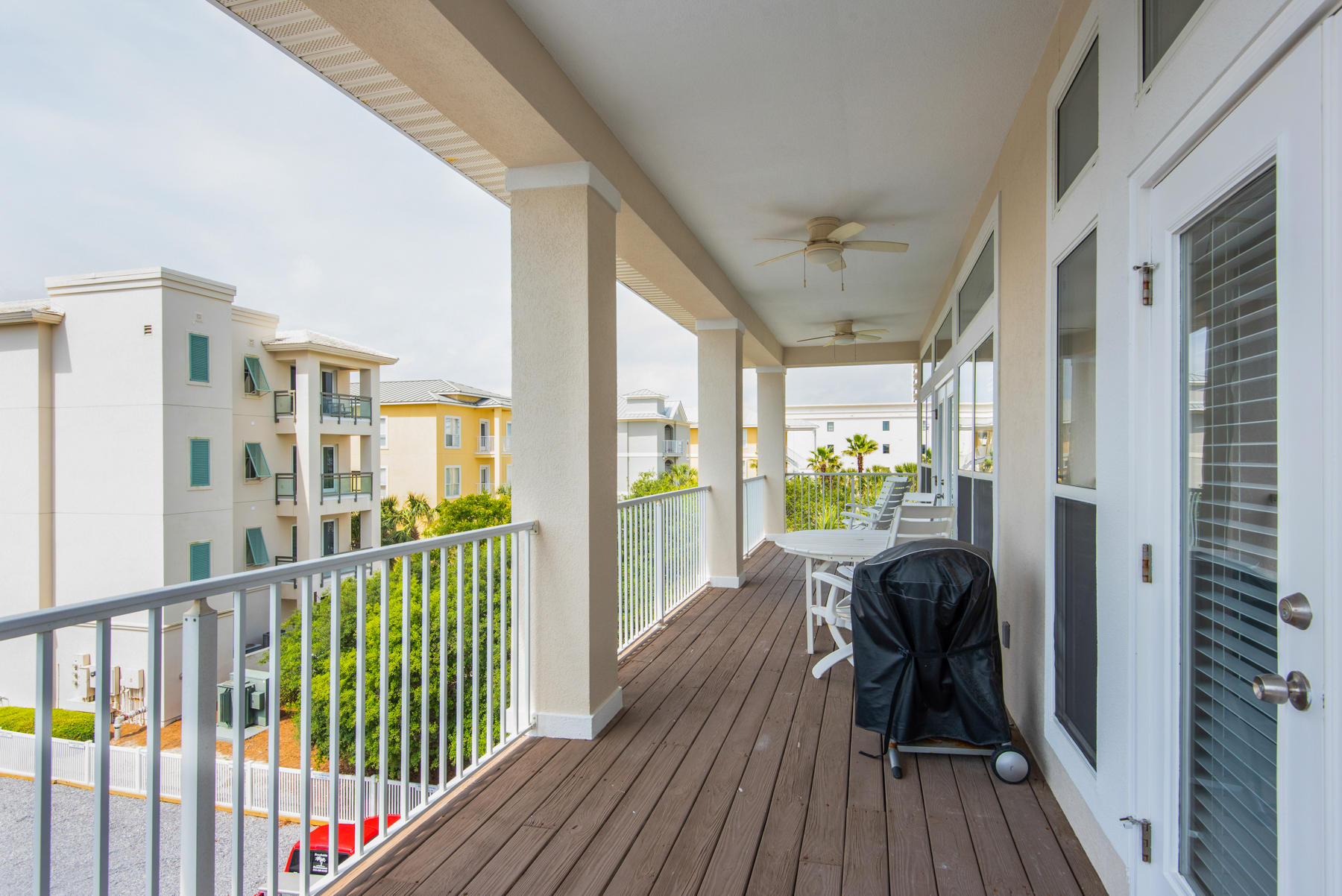 26 Nature Way, Unit 2004 Santa Rosa Beach, FL 32459 - Photo 20 of 65 a view of a balcony with wooden floor
