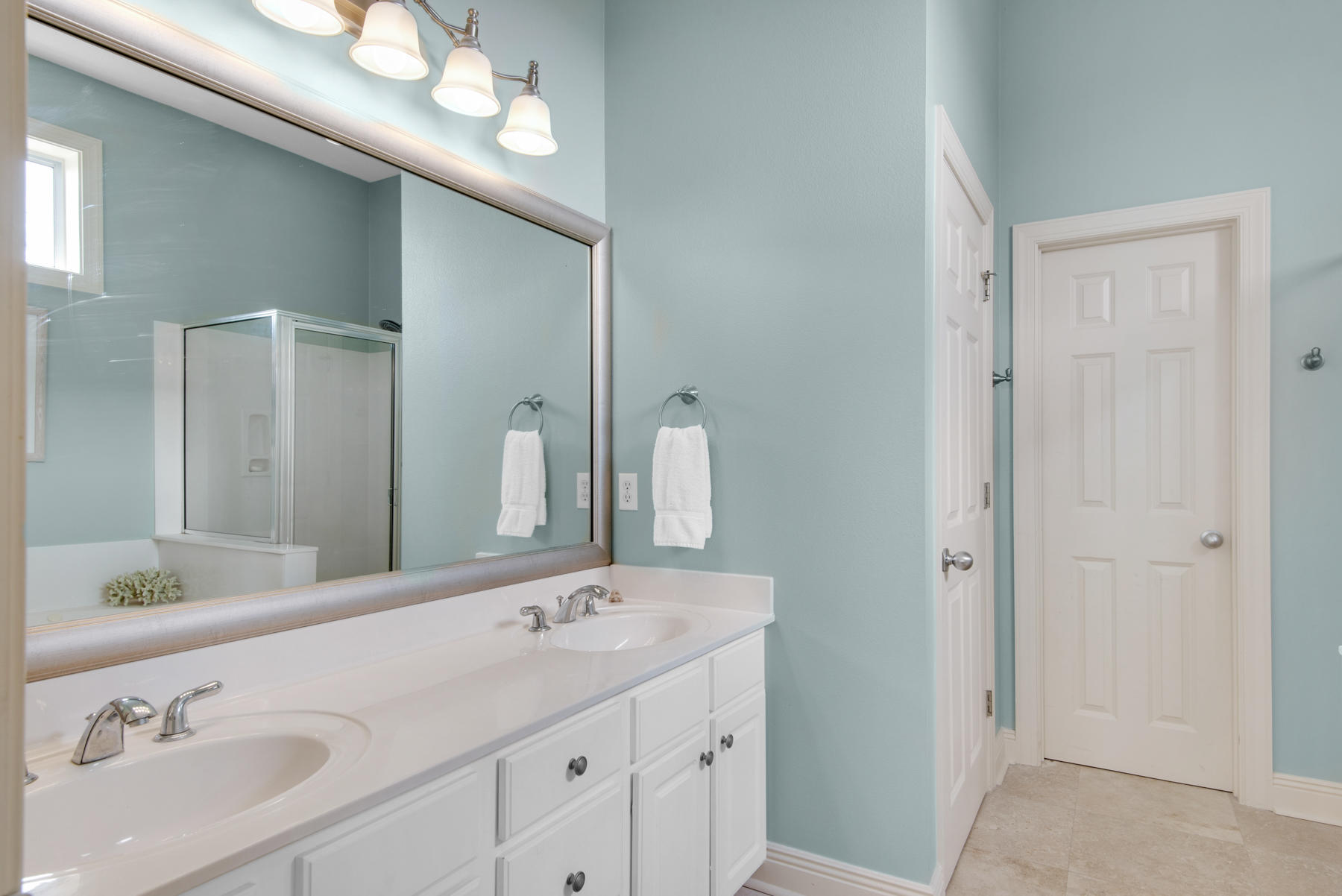 26 Nature Way, Unit 2004 Santa Rosa Beach, FL 32459 - Photo 21 of 65 a bathroom with a double vanity sink and a mirror