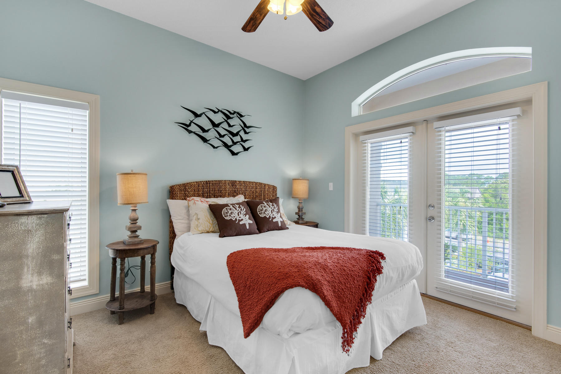 26 Nature Way, Unit 2004 Santa Rosa Beach, FL 32459 - Photo 34 of 65 a bedroom with a large bed and a chandelier
