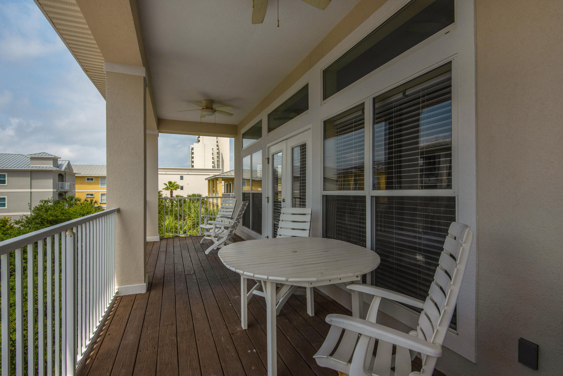 26 Nature Way, Unit 2004 Santa Rosa Beach, FL 32459 - Photo 45 of 65 a view of a balcony with table and chairs