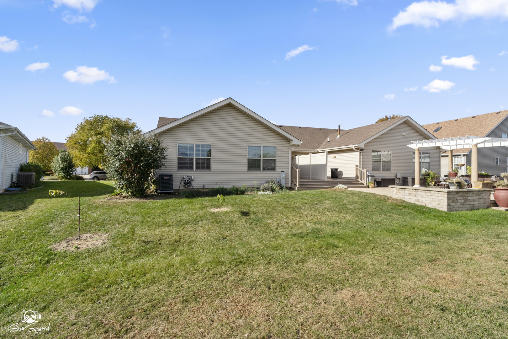 1431 Coral Bell Drive Joliet, IL 60435 - Photo 2 of 38 a view of a yard in front of a house with plants and large tree