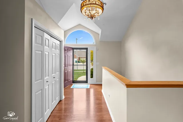 a view of a hallway with front door