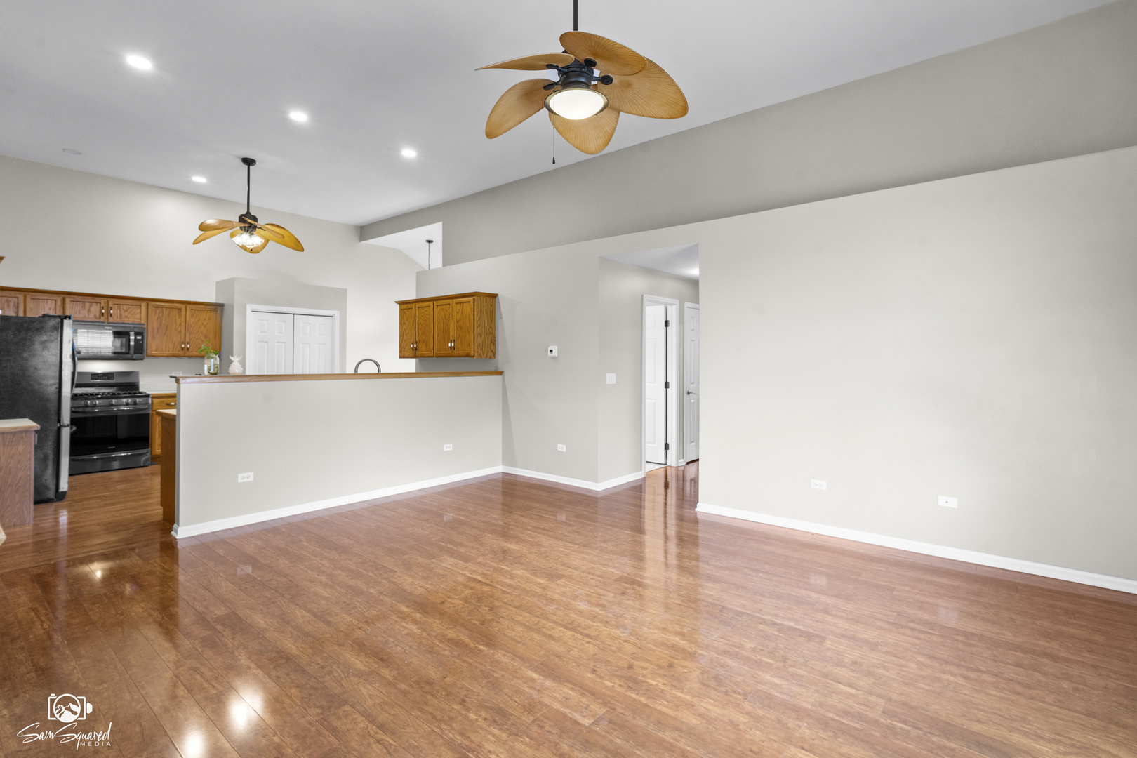 1431 Coral Bell Drive Joliet, IL 60435 - Photo 5 of 38 a view of a kitchen with a stove cabinets and wooden floor