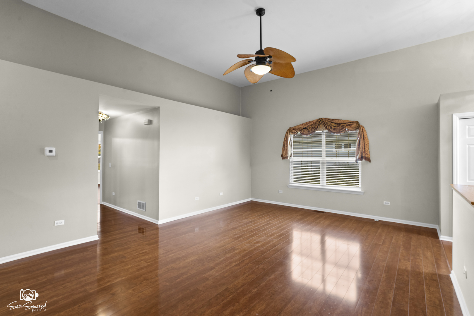 1431 Coral Bell Drive Joliet, IL 60435 - Photo 7 of 38 an empty room with wooden floor and windows