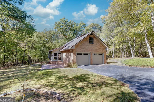 a house with trees in the background