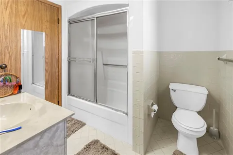 a kitchen with stainless steel appliances granite countertop a sink dishwasher stove and cabinets with wooden floor