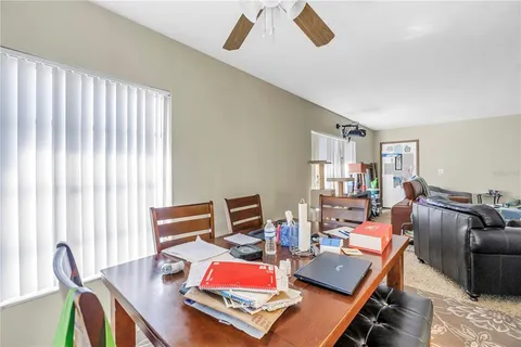 a dining room with furniture and window