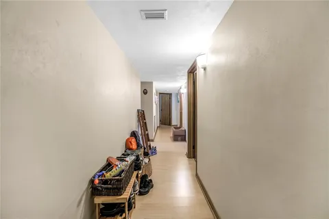 a bed room with a bed and a chair