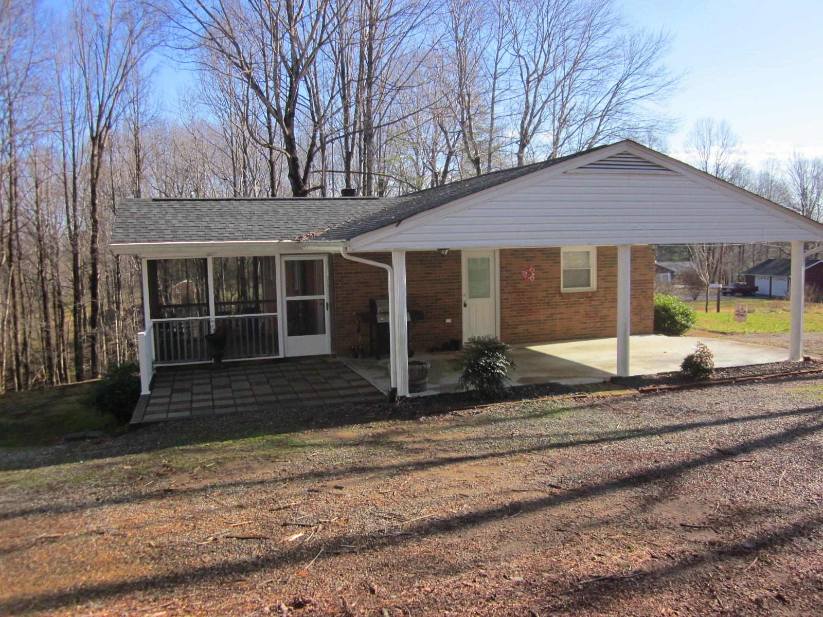 77 Pony Ridge Road Bassett, VA 24055 - Photo 2 of 84 a view of a house with a small yard and large tree
