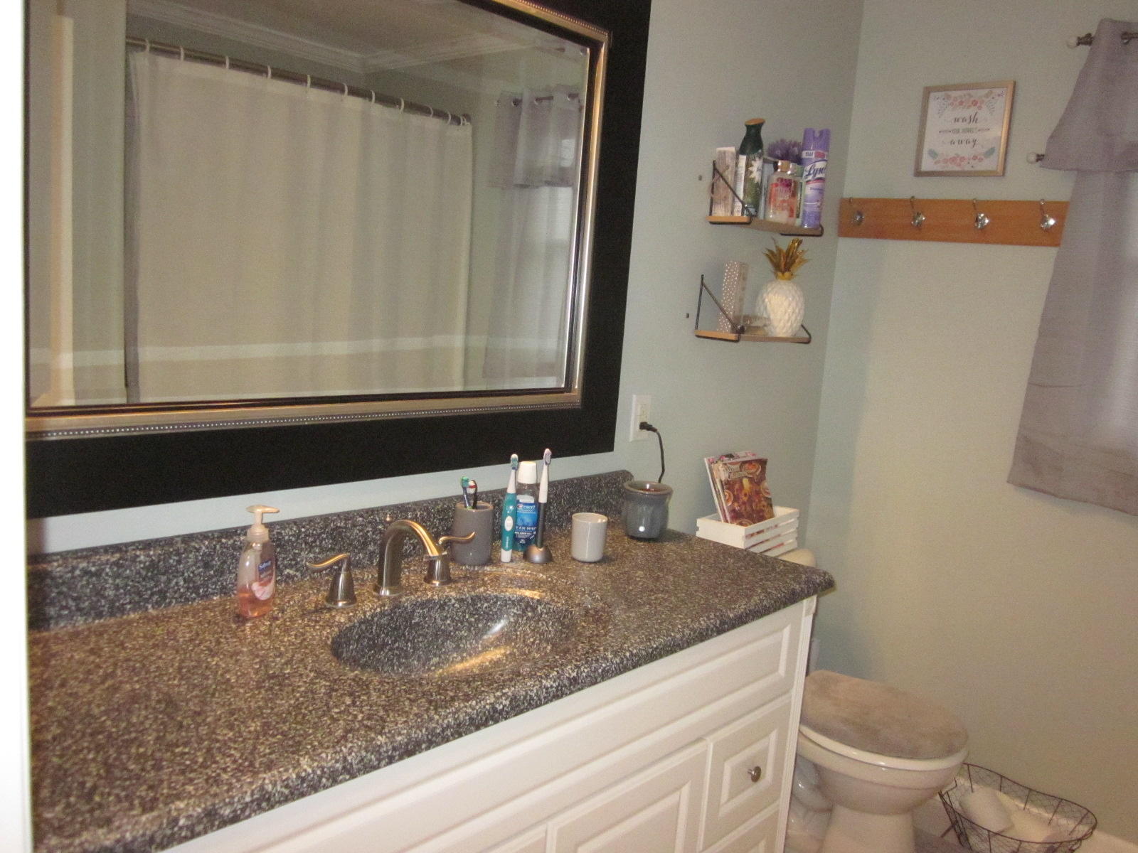 77 Pony Ridge Road Bassett, VA 24055 - Photo 36 of 84 a bathroom with a granite countertop sink and a mirror