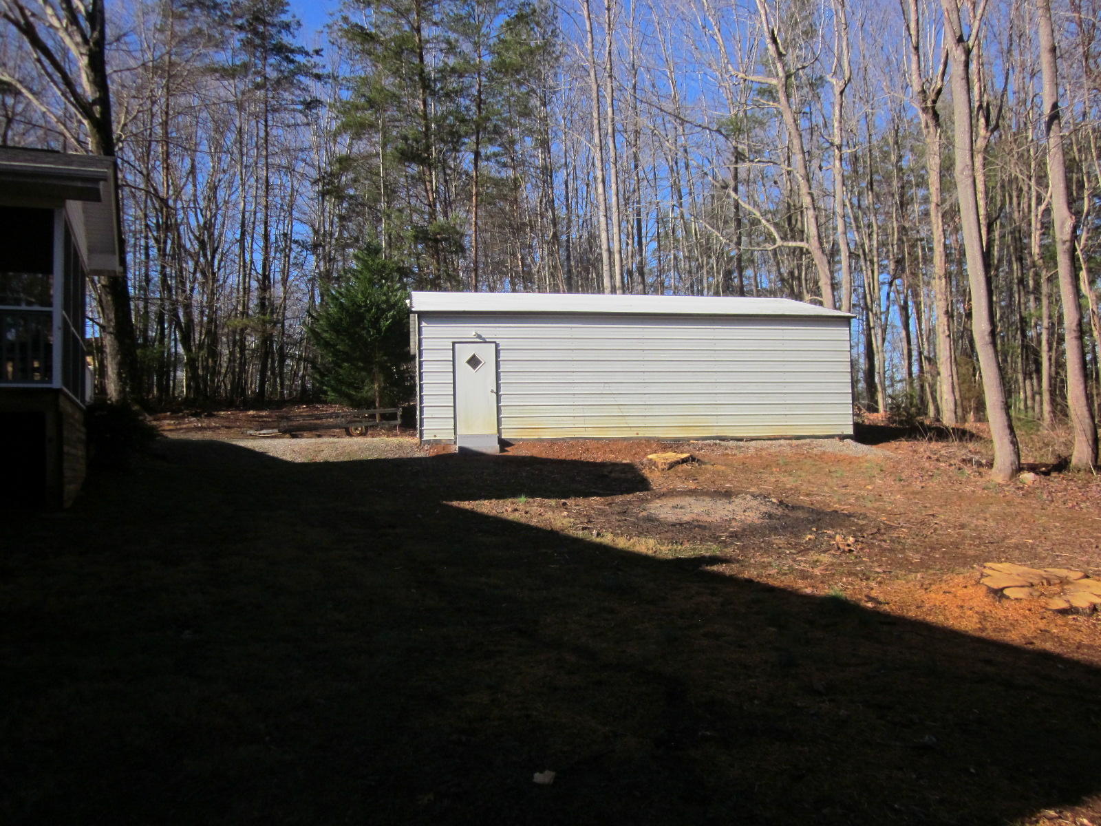 77 Pony Ridge Road Bassett, VA 24055 - Photo 77 of 84 a view of a house with backyard and trees