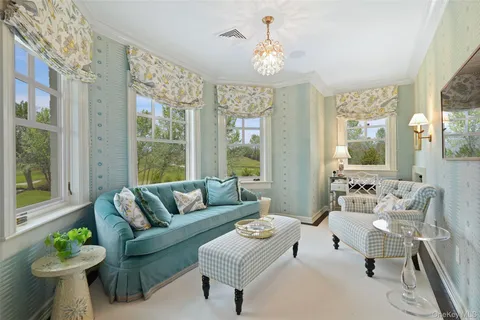 a spacious bathroom with a double vanity sink a mirror and a bathtub