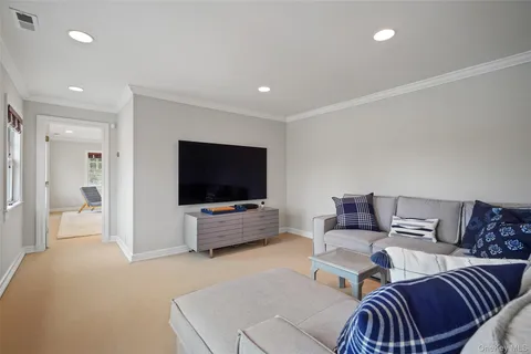 a bathroom with a double vanity sink toilet and shower
