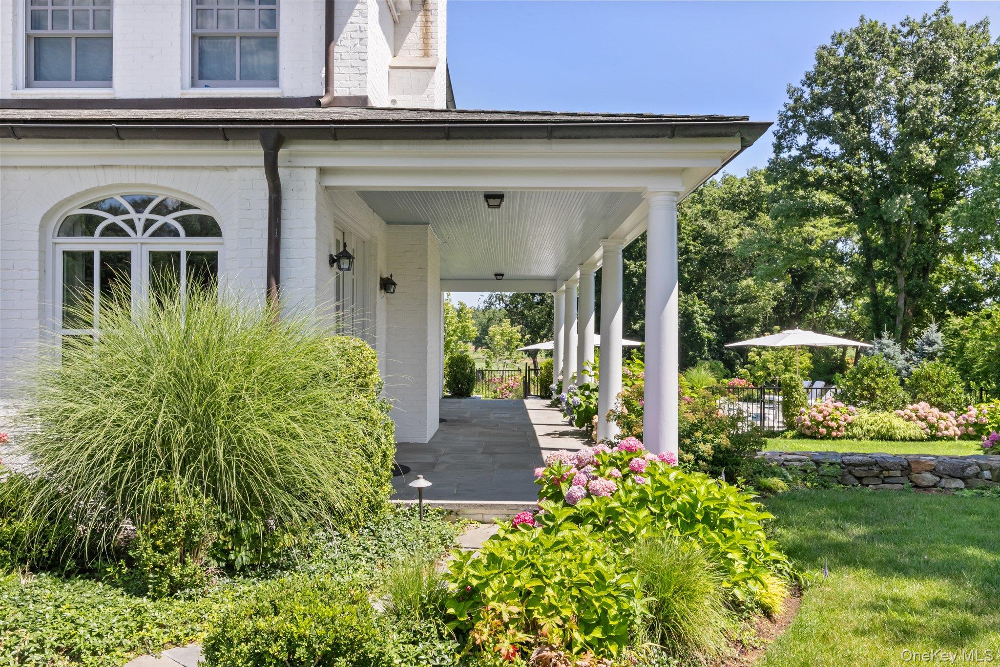 17 Boxwood Lane Rye, NY 10580 - Photo 37 of 41 Covered porch overlooking the pool