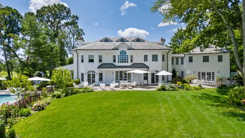 a view of a lake with outdoor space patio and outdoor kitchen
