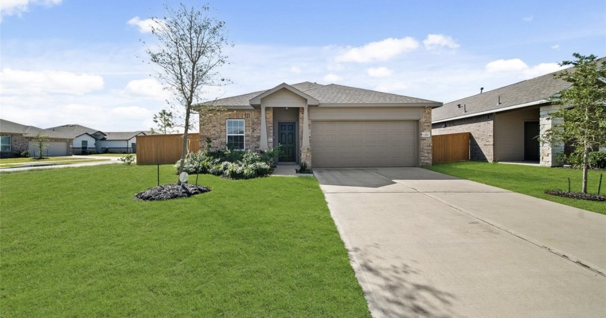 1326 Ponderosa Pne Drive Rosharon, TX 77583 - Photo 1 of 14 a front view of a house with garden