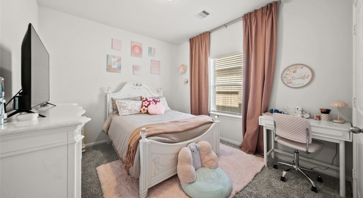 1326 Ponderosa Pne Drive Rosharon, TX 77583 - Photo 13 of 14 a bedroom with a bed and a desk chair