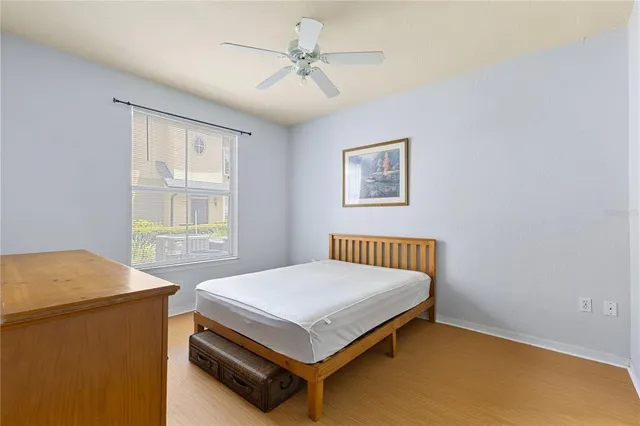 a bedroom with a bed and a table in it