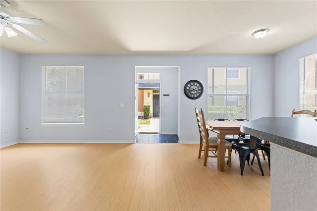 a view of a livingroom with furniture window and wooden floor