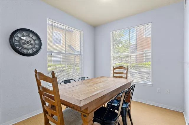 a view of a dining room with furniture and window