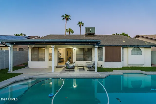 a bedroom with a bed and a potted plant