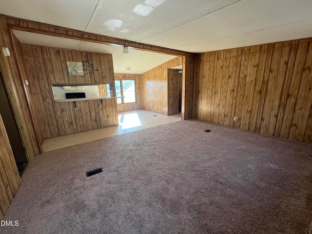 a view of entryway with wooden floor and cabinet