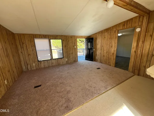 a view of a big room with windows