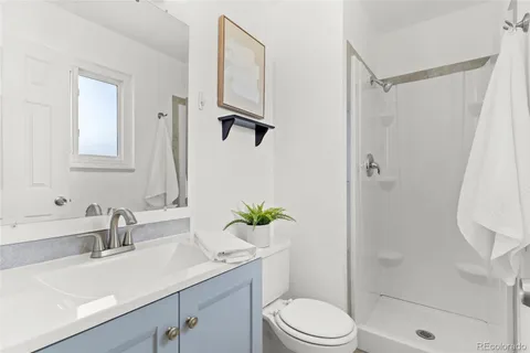 a bedroom with a bed and lamp