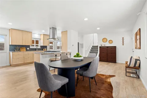 a view of a dining room with furniture window and wooden floor