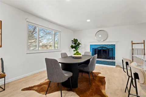 a kitchen with stainless steel appliances granite countertop a stove a sink and white cabinets