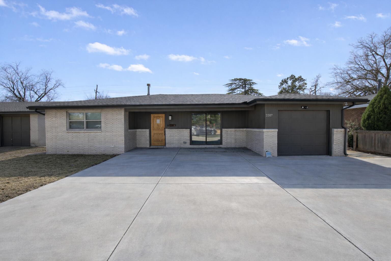 a front view of a house with a garage