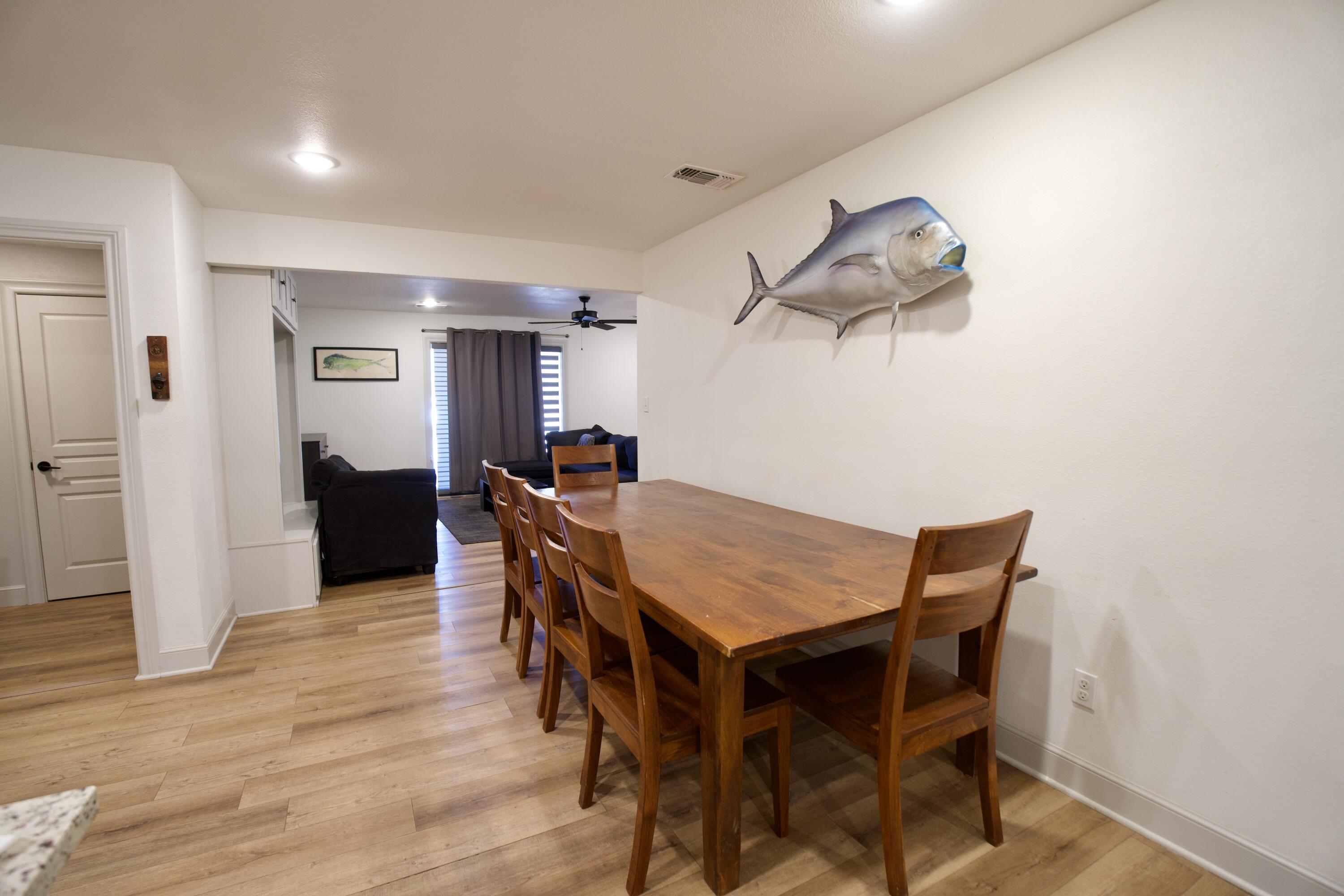 2517 52nd Street Lubbock, TX 79413 - Photo 7 of 17 a dining room with a wooden table and chairs