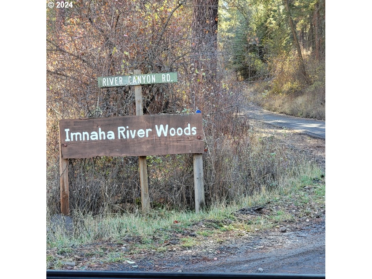 River Canyon Road, Unit TL 900 Imnaha, OR 97842 - Photo 8 of 10 a sign that is sitting on a wooden wall