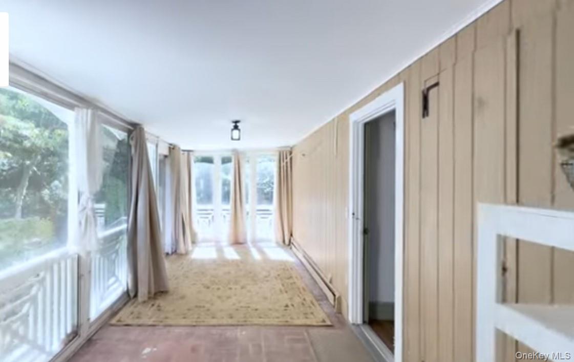 24 Hawkins Road Stony Brook, NY 11790 - Photo 12 of 45 a view of a hallway with windows