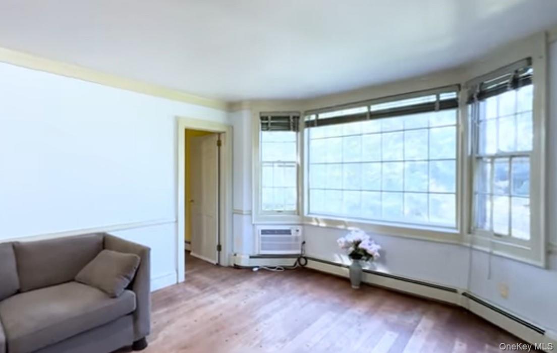 24 Hawkins Road Stony Brook, NY 11790 - Photo 13 of 45 a living room with furniture and a window