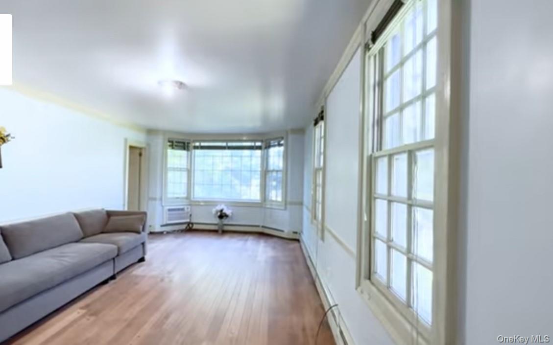 24 Hawkins Road Stony Brook, NY 11790 - Photo 14 of 45 a living room with furniture and a large window