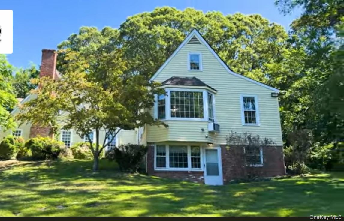 24 Hawkins Road Stony Brook, NY 11790 - Photo 17 of 45 a front view of house with yard and green space