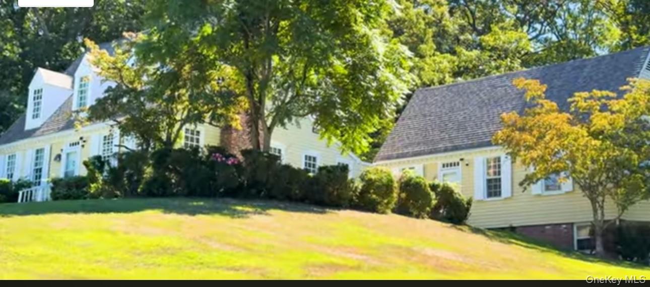 24 Hawkins Road Stony Brook, NY 11790 - Photo 18 of 45 a view of backyard of house with green space