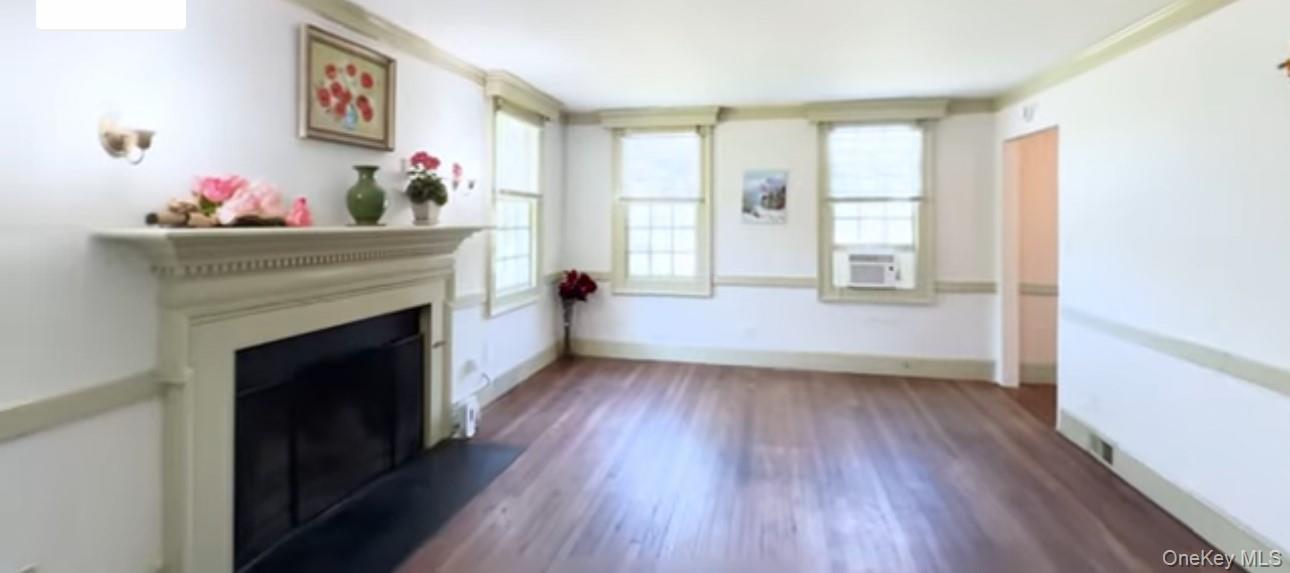 24 Hawkins Road Stony Brook, NY 11790 - Photo 2 of 45 a living room with furniture and a fireplace