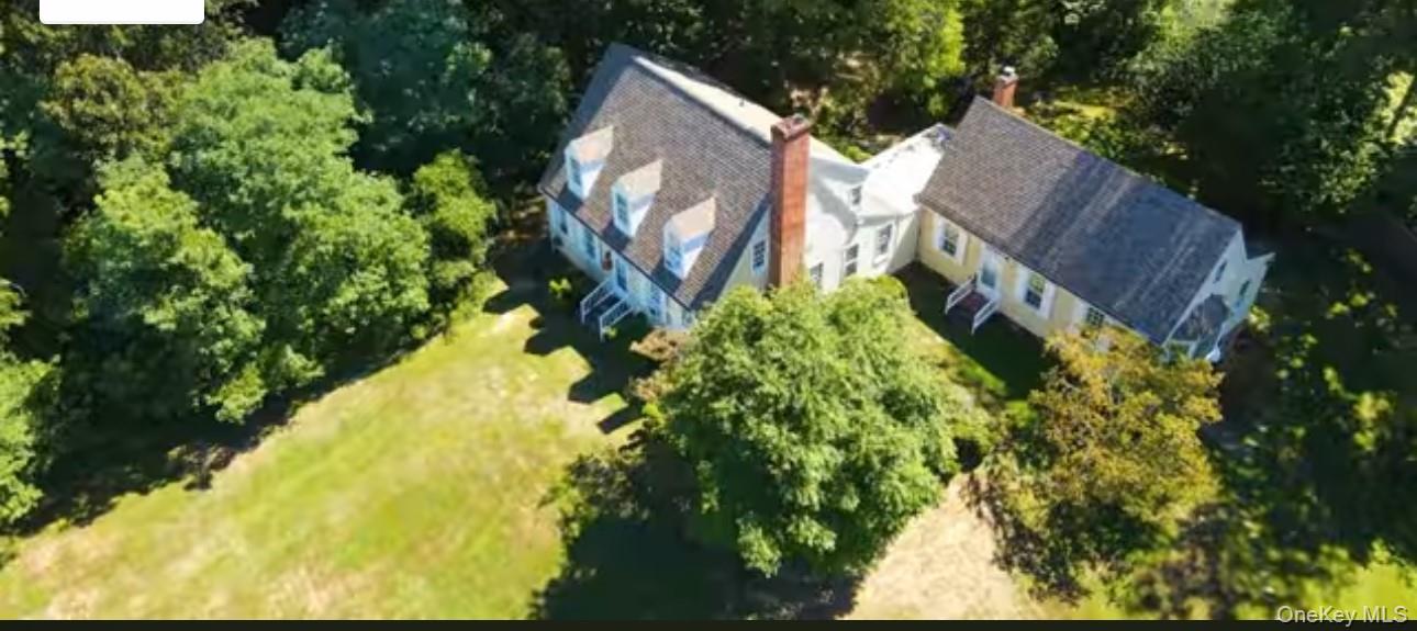 24 Hawkins Road Stony Brook, NY 11790 - Photo 22 of 45 a aerial view of a house with a yard and garden
