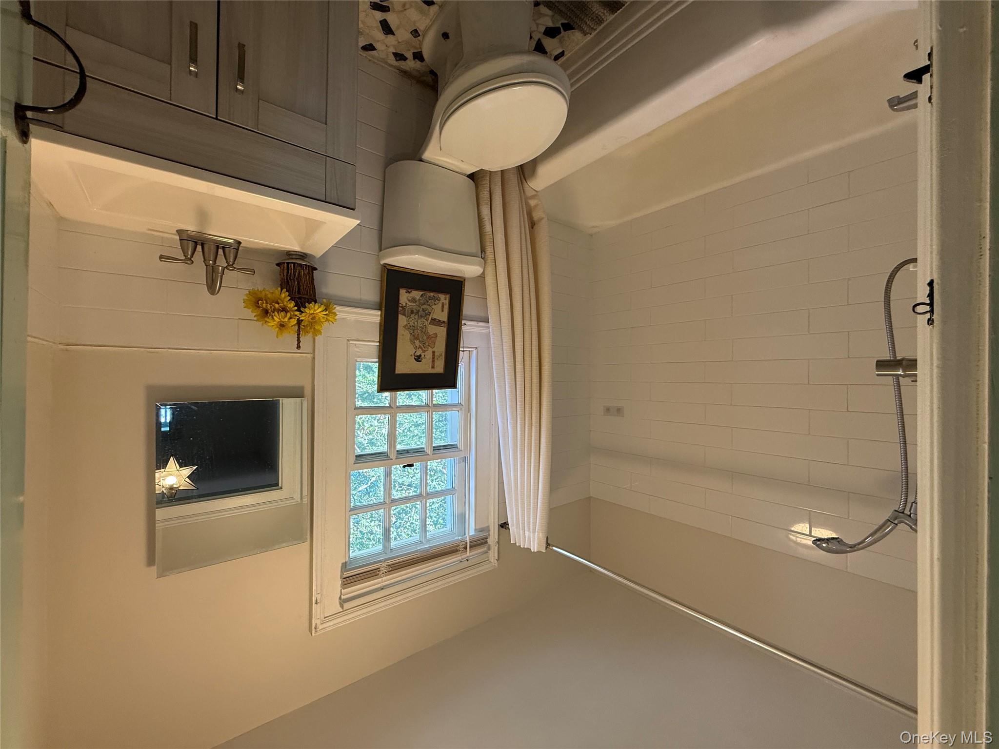 24 Hawkins Road Stony Brook, NY 11790 - Photo 26 of 45 a bathroom with a sink toilet and shower