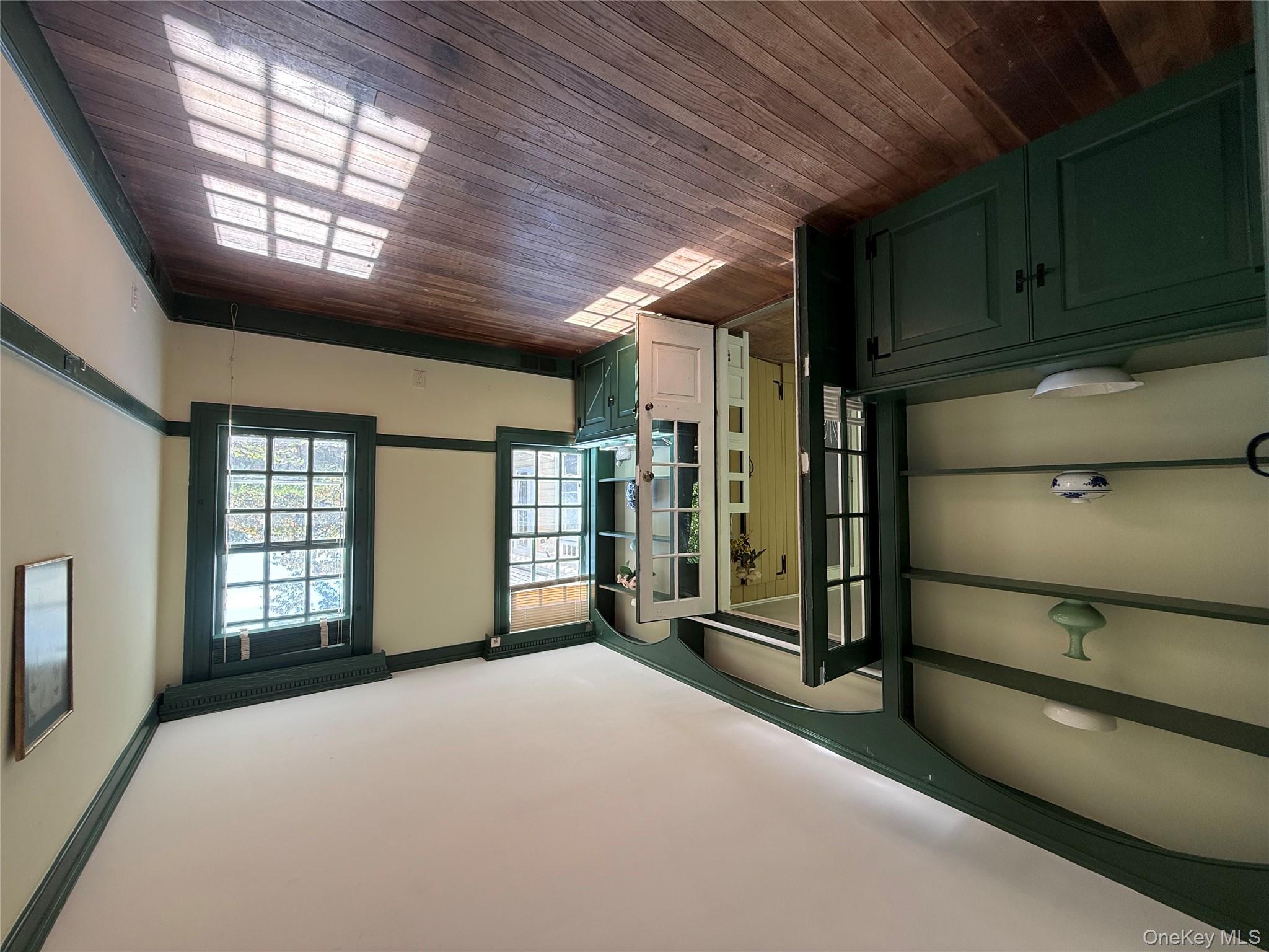 24 Hawkins Road Stony Brook, NY 11790 - Photo 31 of 45 a view of a room with window and wooden floor