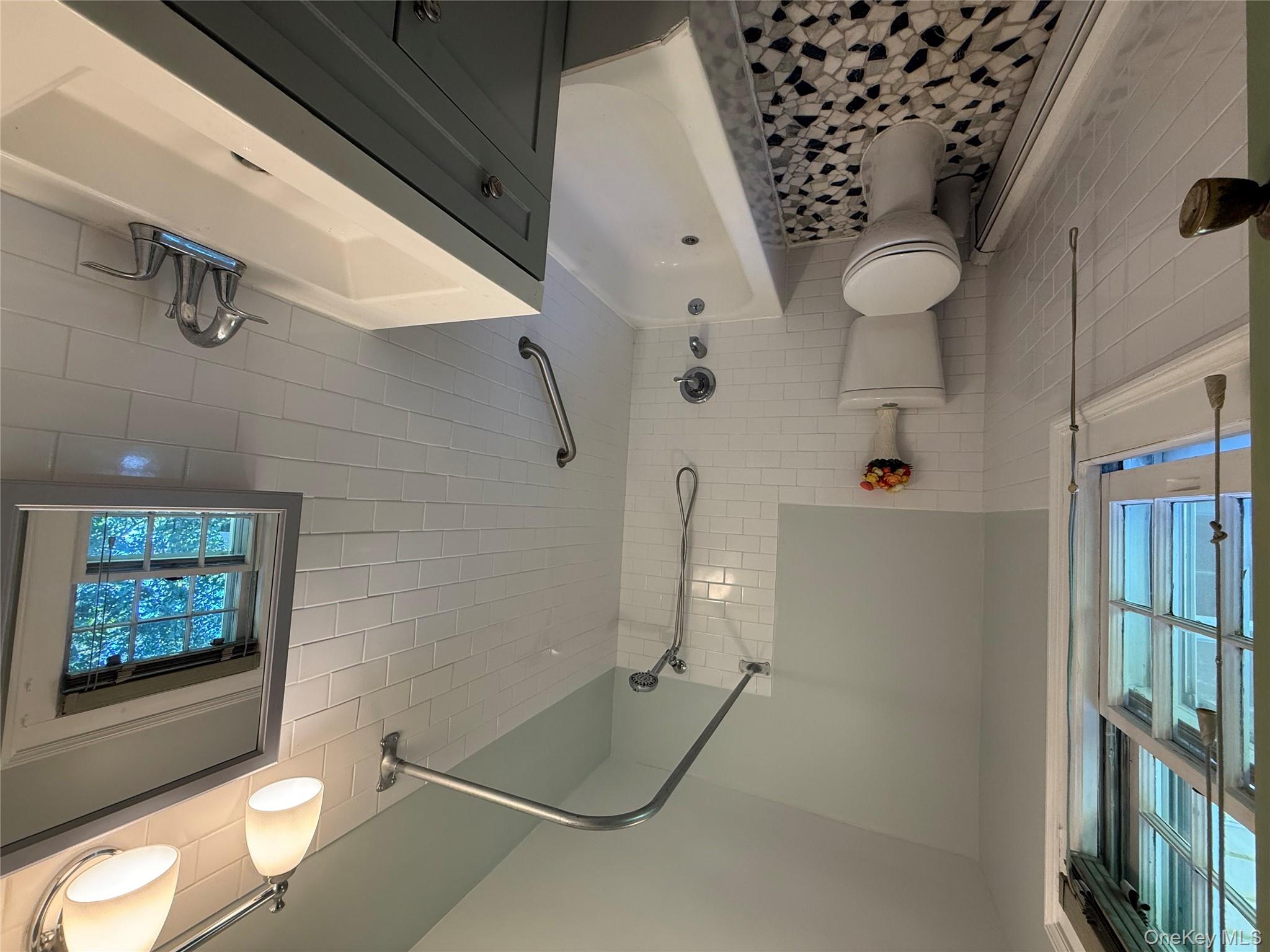 24 Hawkins Road Stony Brook, NY 11790 - Photo 32 of 45 a bathroom with a sink toilet and shower