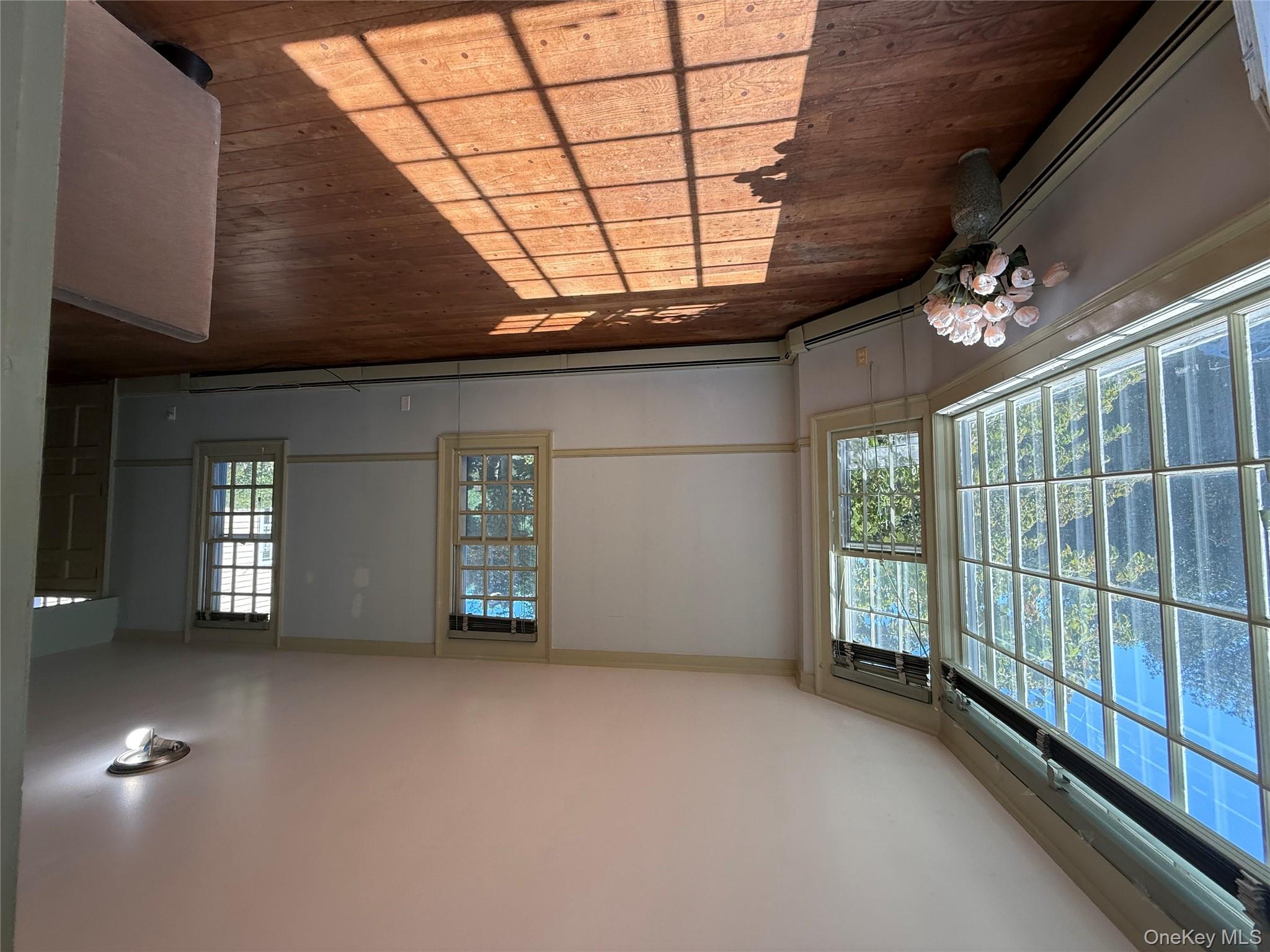 24 Hawkins Road Stony Brook, NY 11790 - Photo 36 of 45 a view of a living room and a window