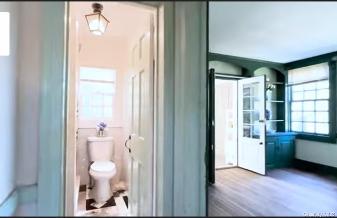 24 Hawkins Road Stony Brook, NY 11790 - Photo 4 of 45 a view of bathroom with a tub shower and a sink