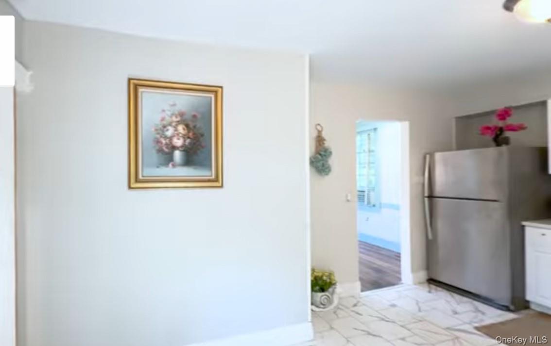 24 Hawkins Road Stony Brook, NY 11790 - Photo 6 of 45 a white refrigerator freezer sitting inside of a kitchen